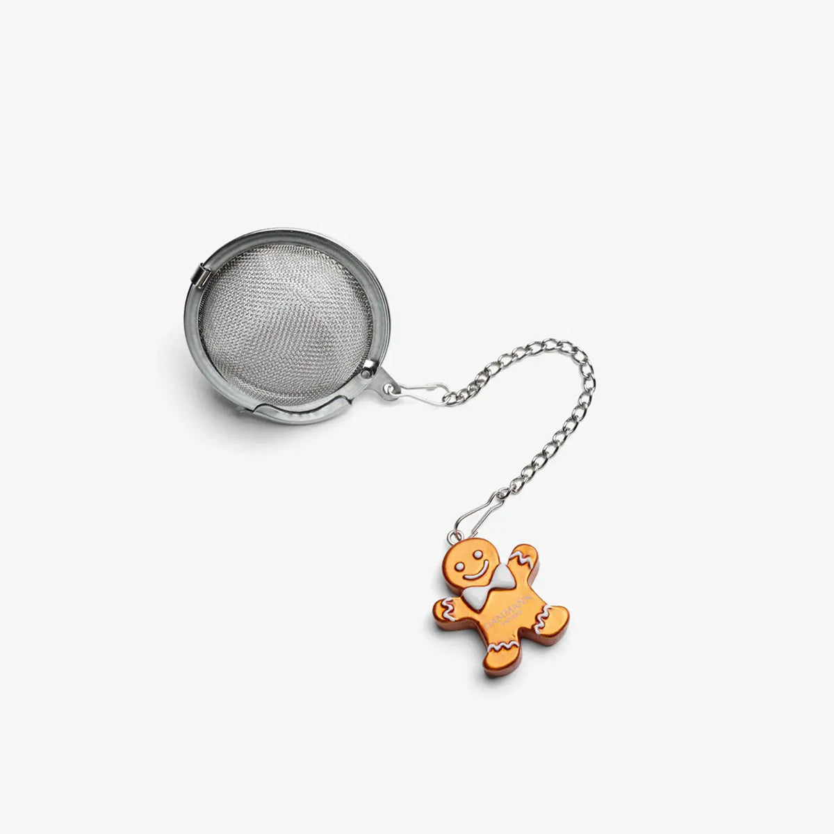 Boule à thé Gingerbread Dammann Frères en acier inoxydable avec un bonhomme en pain d’épices en résine.